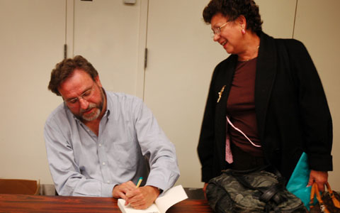 Signing a book for an admiring fan: Robert Balmanno at an April 2007 book talk, held at the Sunnyvale Public Library